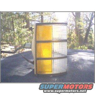 Clear and amber tail light assembly with SuperMotors logo