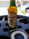 1996 Ford Probe - A silver minivan is visible in the background behind a bottle of Yuengling Traditional Lager and a roll of tape.