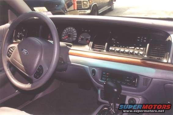 2002 Ford Crown Victoria interior dashboard with steering wheel and radio