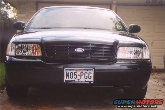 Black 2002 Ford Crown Victoria front view, grille with Ford badge, Texas license plate N05-PGG