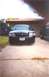 2002 Ford Crown Victoria - Front view of a black 2002 Ford Crown Victoria parked in a driveway.