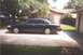 2002 Ford Crown Victoria - Side view of a 2002 Ford Crown Victoria parked in a residential driveway.