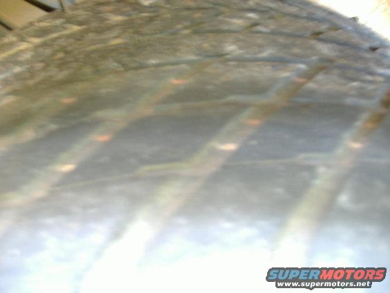 Tire tread with orange markings