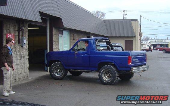 Blue 1986 Ford Bronco 3/4 front view with roll bar