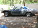 1969 Ford Torino - This 1969 Ford Torino coupe is in a state of disrepair, with its front end disassembled and primer gray paint.