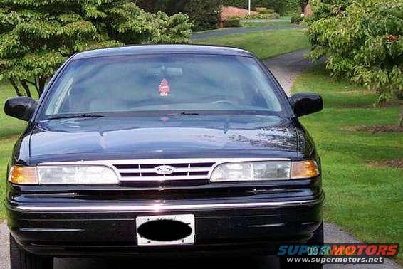 Black Ford Crown Victoria parked on a driveway