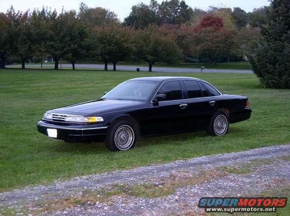 Black 1997 Ford Crown Victoria sedan, 3/4 front view