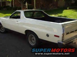 White Ford Ranchero pickup truck, rear quarter view. Supermotors watermark visible