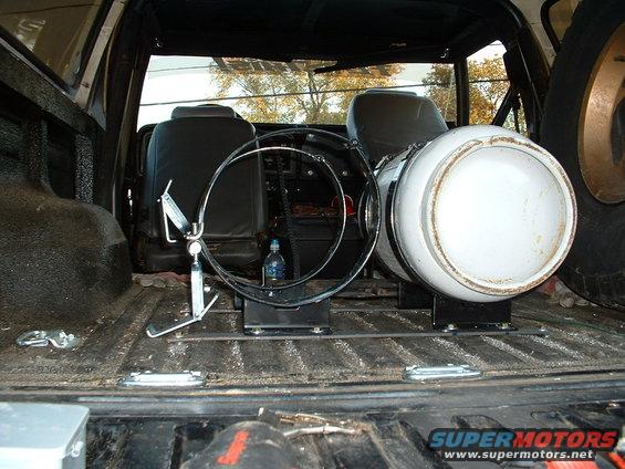 Interior view of 1978 Ford Bronco with propane tank and spare tire