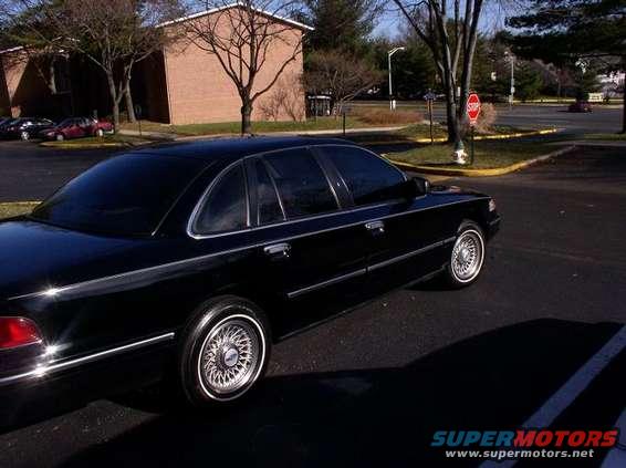 Black 1997 Ford Crown Victoria sedan, 3/4 front view