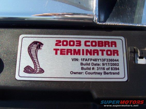 Close-up of a 2003 Cobra Terminator badge with VIN and build date