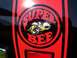 1973 Ford Mustang - Close-up of a Super Bee decal on a black vehicle. The decal features a bee mascot and the words 'SUPER BEE'.