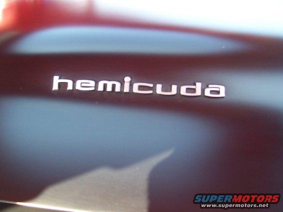 Close-up of a 'Hemicuda' badge on a car's body