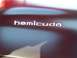 1973 Ford Mustang - The 'Hemicuda' badge is visible on the car's dark-colored exterior.