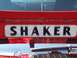 1973 Ford Mustang - A close-up view of a red car's rear decklid displays a "SHAKER" badge.