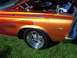 1973 Ford Mustang - A custom hot rod with flame paint and chrome accents sits on grass.