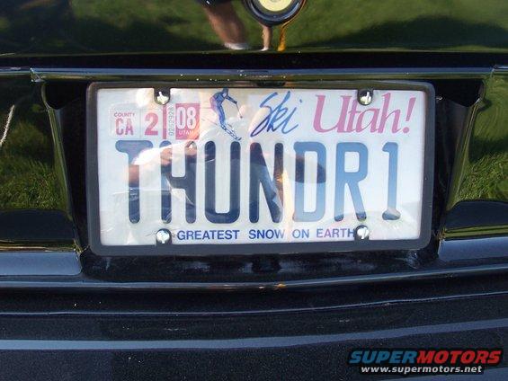 Black car rear bumper with a California license plate reading THUNDR1 and a "Ski Utah!" graphic