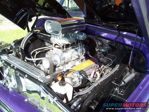 Engine bay with chrome supercharger and purple paint