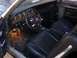 1971 Mercury Cyclone - The interior of a car shows black vinyl seats and a dashboard with round gauges.