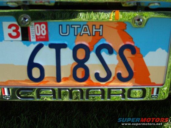 Utah license plate 6T8SS on a car with 'CAMARO' emblem below