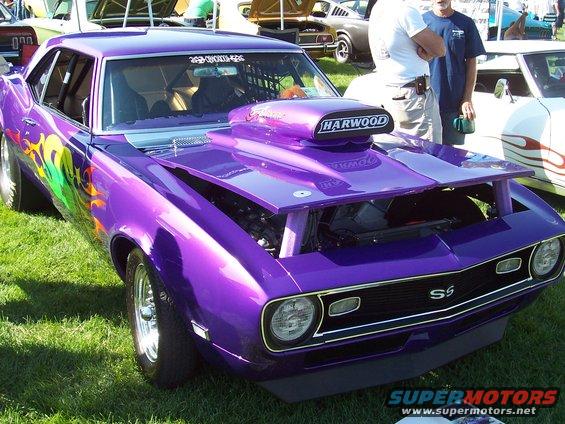 Purple 1969 Chevrolet Camaro drag car with flames and scoop