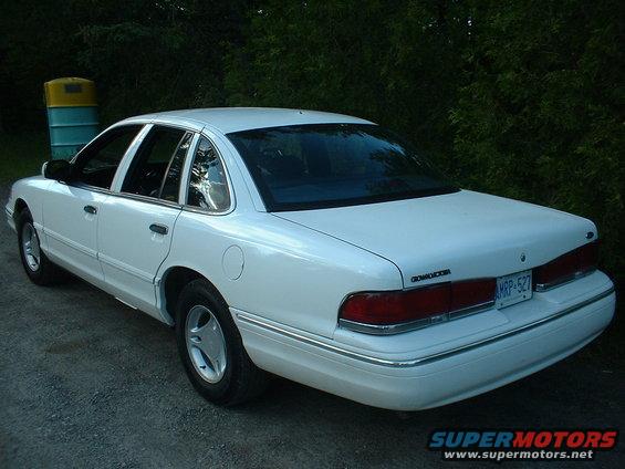 This was about 3 years ago, yes those are pony rims on a CV, it took a slight amount of grinding the calipers but hey, I thought they worked and everyone agreed.  You can see the antenna mount on the roof, plus, when I removed the side bumper gaurds, there were holes in the rear doors.  Ford explained that it's so they can open the doors in a emergency to the rear.  Whatever.
