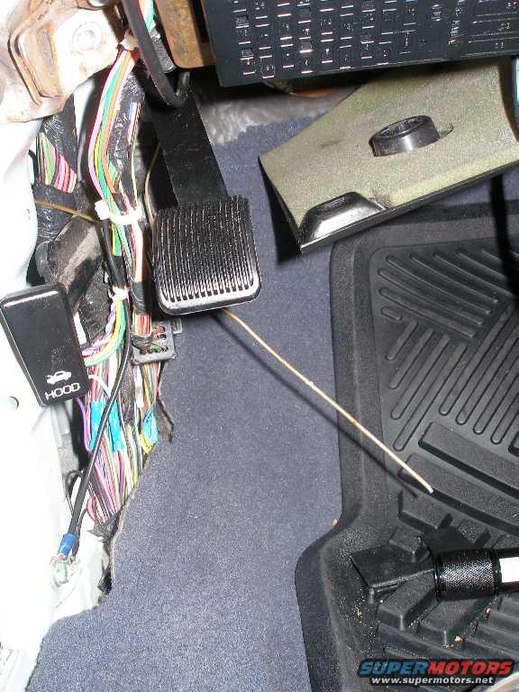 hanger.jpg Use a hanger to snake the wiring back throw the rubber "tunnel" between the door and body. 