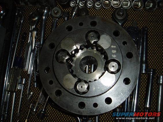 Close-up of a locking differential part with various tools laid out around it