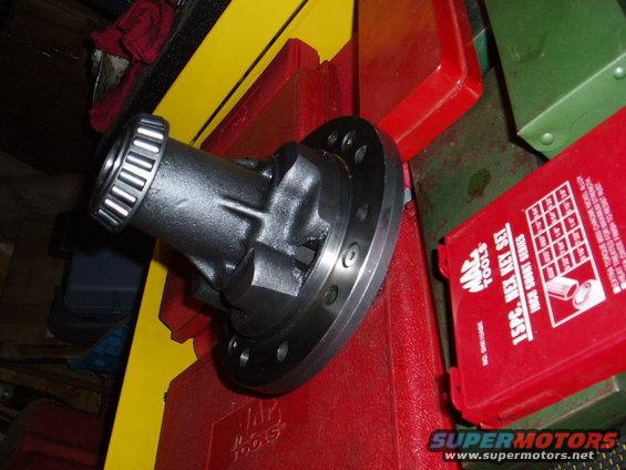 Differential carrier with bearing on top of red and yellow toolboxes. A MAC Tools hex key set is also visible