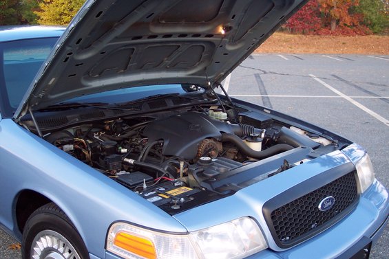 Blue 2001 Ford Crown Victoria engine bay with hood open