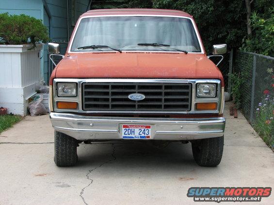 Red 1986 Ford Bronco front view with Ford grille and South Dakota license plate