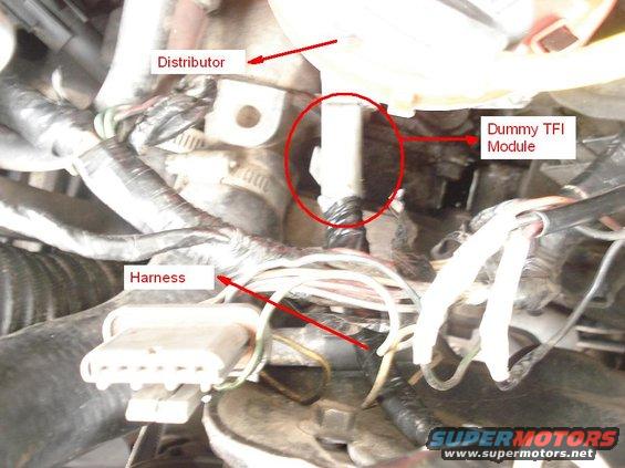 21.jpg Removed the module from the distributor and connected the dummy module harness. Picture is not good but will do.