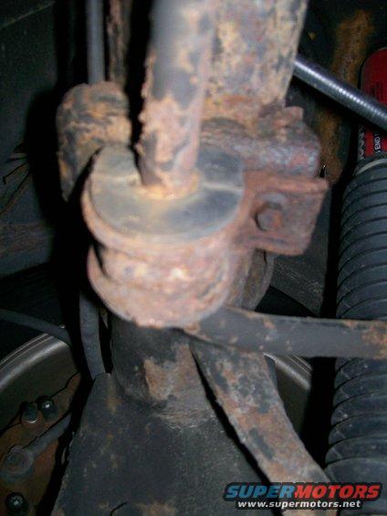 Rusted suspension part with rubber bushing