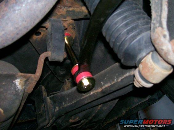 Rear sway bar with red bushings and gold hardware