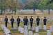 1991 Ford Bronco - A group of soldiers stand at attention in a cemetery, likely a memorial service.