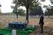1991 Ford Bronco - A solemn scene unfolds in a military cemetery as a soldier stands at attention beside a coffin.