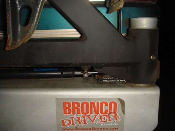 Close-up of a sticker that says "Bronco Driver Magazine" on a metal part of a vehicle