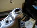 1996 Ford Bronco - A close-up view of a metal suspension component, likely undergoing repair or modification.