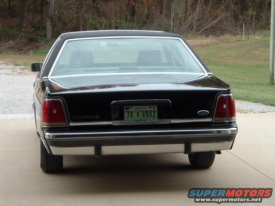 Rear view of a black 1989 Ford Crown Victoria LTD with an Indiana license plate
