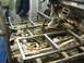 1994 Jeep YJ - Metal framing is being installed inside a vehicle, obscuring the transmission and floor components.