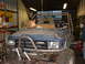 1994 Jeep YJ - This heavily modified Toyota appears to be undergoing custom fabrication in a workshop setting.