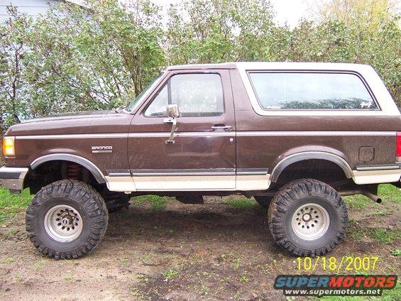 Brown 1988 Ford Bronco side view with off-road tires