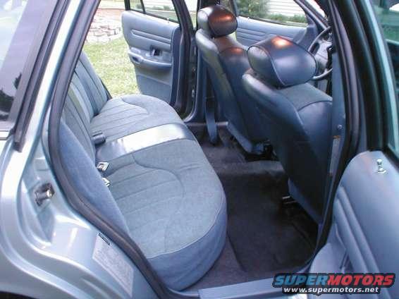 Back seat and front seats of a car, viewed from the passenger side rear door
