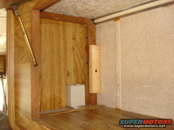 front-bunk12.jpg here is the same space without the false wall in place. there is an outlet on the front of the cabinet so there was a spacer in place as well. i put in a 1X4 across the main support to hold the bunk lock. there is no real weight on it so it will be fine.