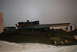1991 Ford Bronco - Rifle with scope, bipod, and various ammunition loads displayed on a cloth surface.
