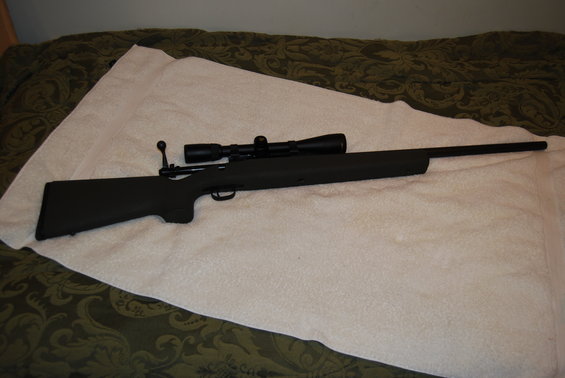 Rifle with scope, side view