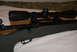 1991 Ford Bronco - A rifle with a scope is shown in detail.