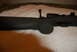 1991 Ford Bronco - A rifle's bolt action mechanism is visible in this close-up shot.