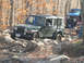 1994 Ford F-250 - Jeep Wrangler Rubicon tackles a challenging off-road course during autumn.