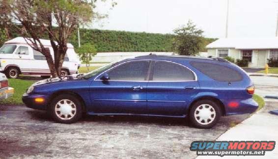 Blue 1997 Mercury Sable station wagon, side view